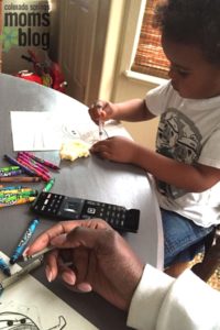 My son humoring me by coloring and acting like he liked it.