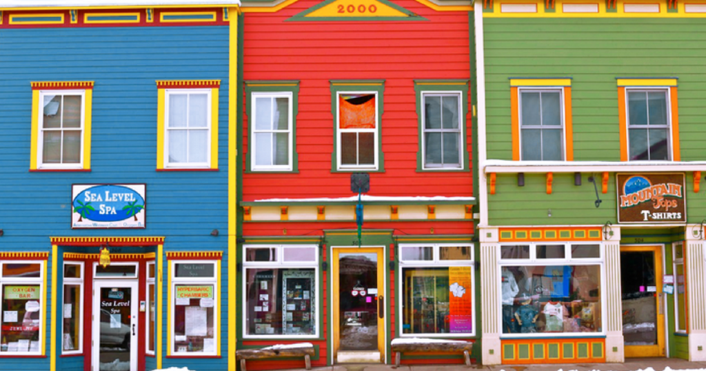 Three brightly colored buildings in downtown Crested Butte. 